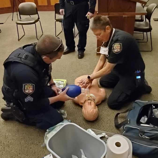 Police Officers practicing CPR