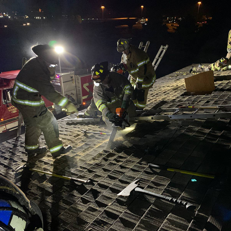 firefighters-on-roof-at-night