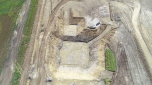 Drone photo showing dirt work and initial building work at the new Waste Water Treatment Plant