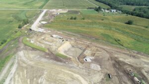 Drone photo showing dirt work and initial building work at the new Waste Water Treatment Plant
