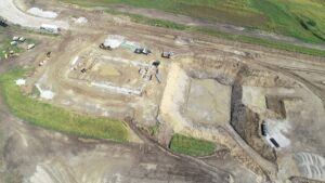 Drone photo showing dirt work and initial building work at the new Waste Water Treatment Plant