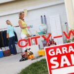 Words "City-Wide" with a garage sale sign and people at a garage sale in the background.