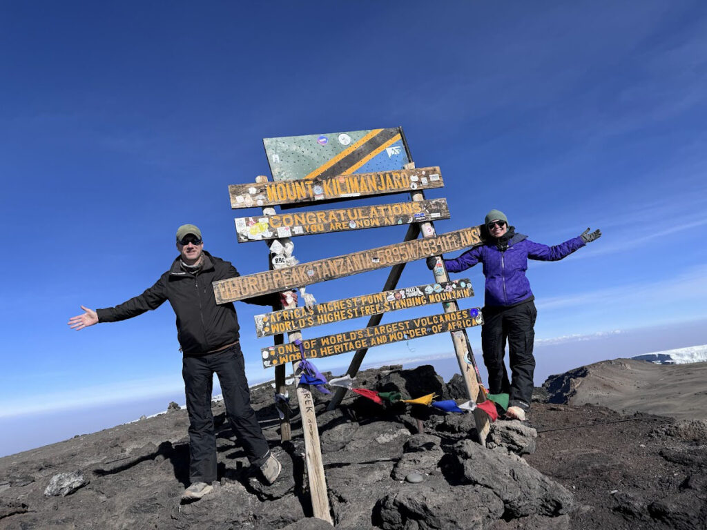 Nevada couple Jimmy and Katie Woodard are shown at the summit of Mount Kilimanjaro.