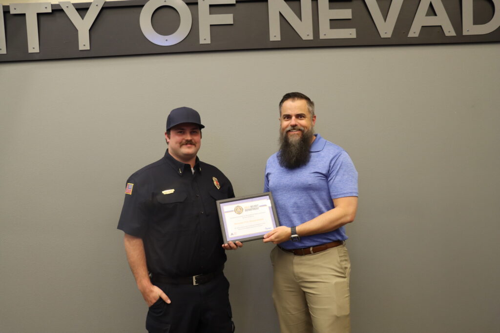 Lt. Nick Brown is pictured with Mayor Brett Barker.