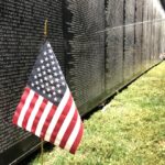 American Flag next to The Wall That Heals