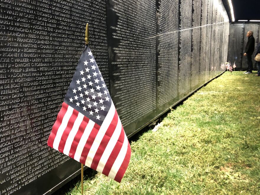 American Flag next to The Wall That Heals