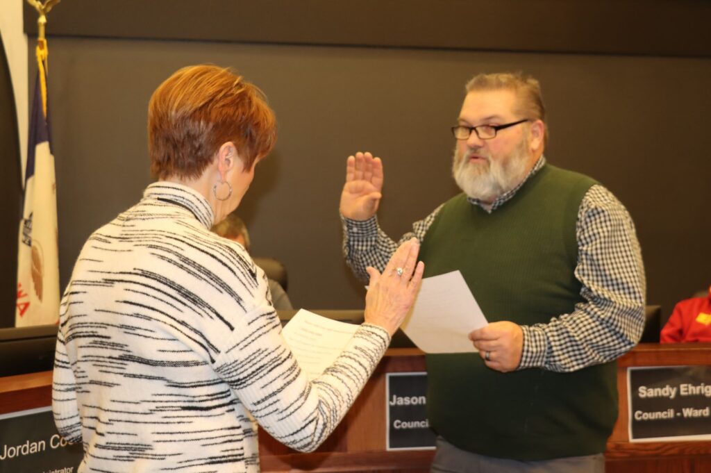 Brian Hanson takes oath of office as administered by Mayor Pro Tem Sandy Ehrig