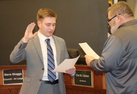 Broc Davidson takes the oath, administered by Brian Hanson, mayor