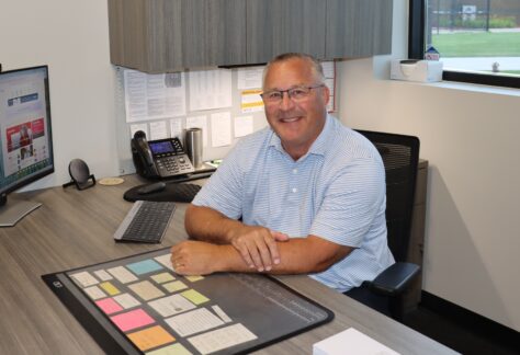 Tim Hansen sitting in his office at the Field House