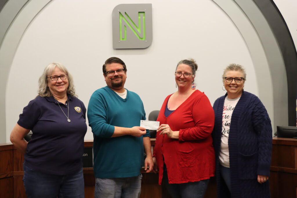 Mayor Ryan Condon poses for a picture with three representatives of the American Legion Auxiliary as they present a check for $1,000.
