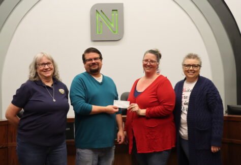 Mayor Ryan Condon poses for a picture with three representatives of the American Legion Auxiliary as they present a check for $1,000.