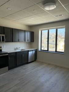 This second story apartment shows the natural light that many of the apartments in this project have, utilizing windows that were in use when the building was a hospital.