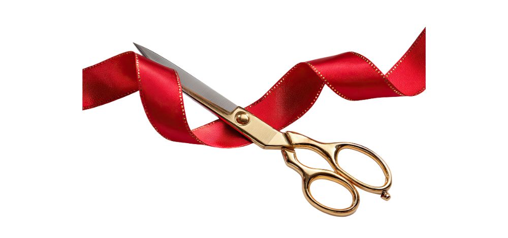 graphic of a red ribbon and gold scissors