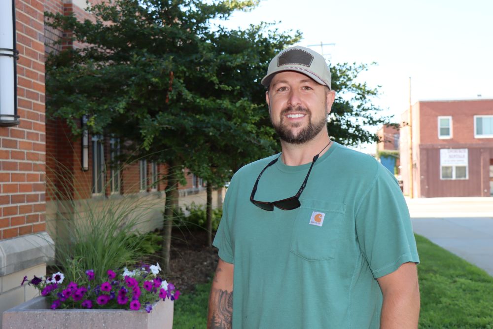 Cory Harmon is pictured outside of City Hall