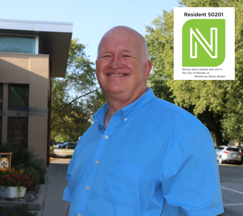 Terry Webster is pictured outside of the Nevada Library building.