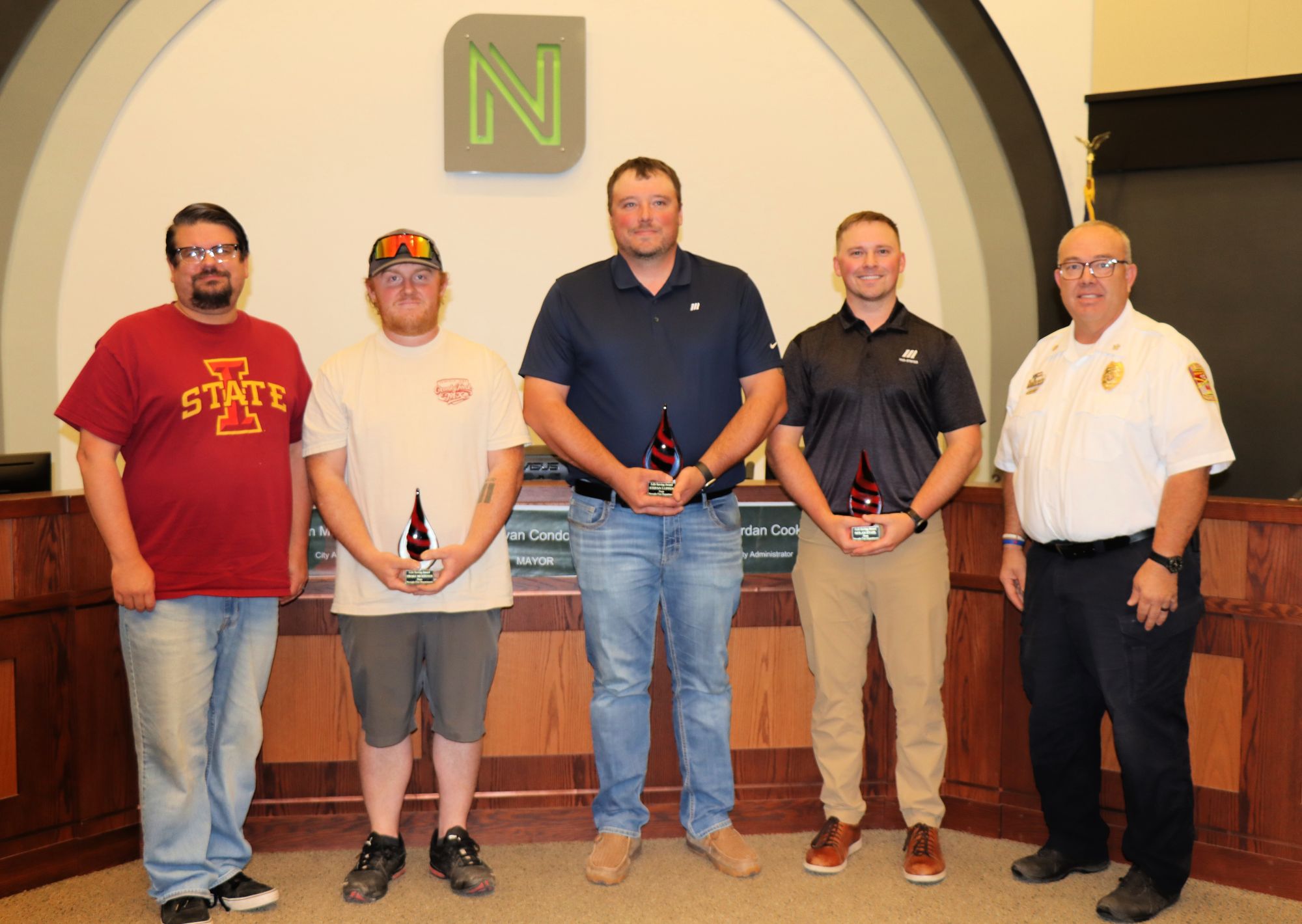The mayor and fire chief are pictured with the three Mid-States employees.
