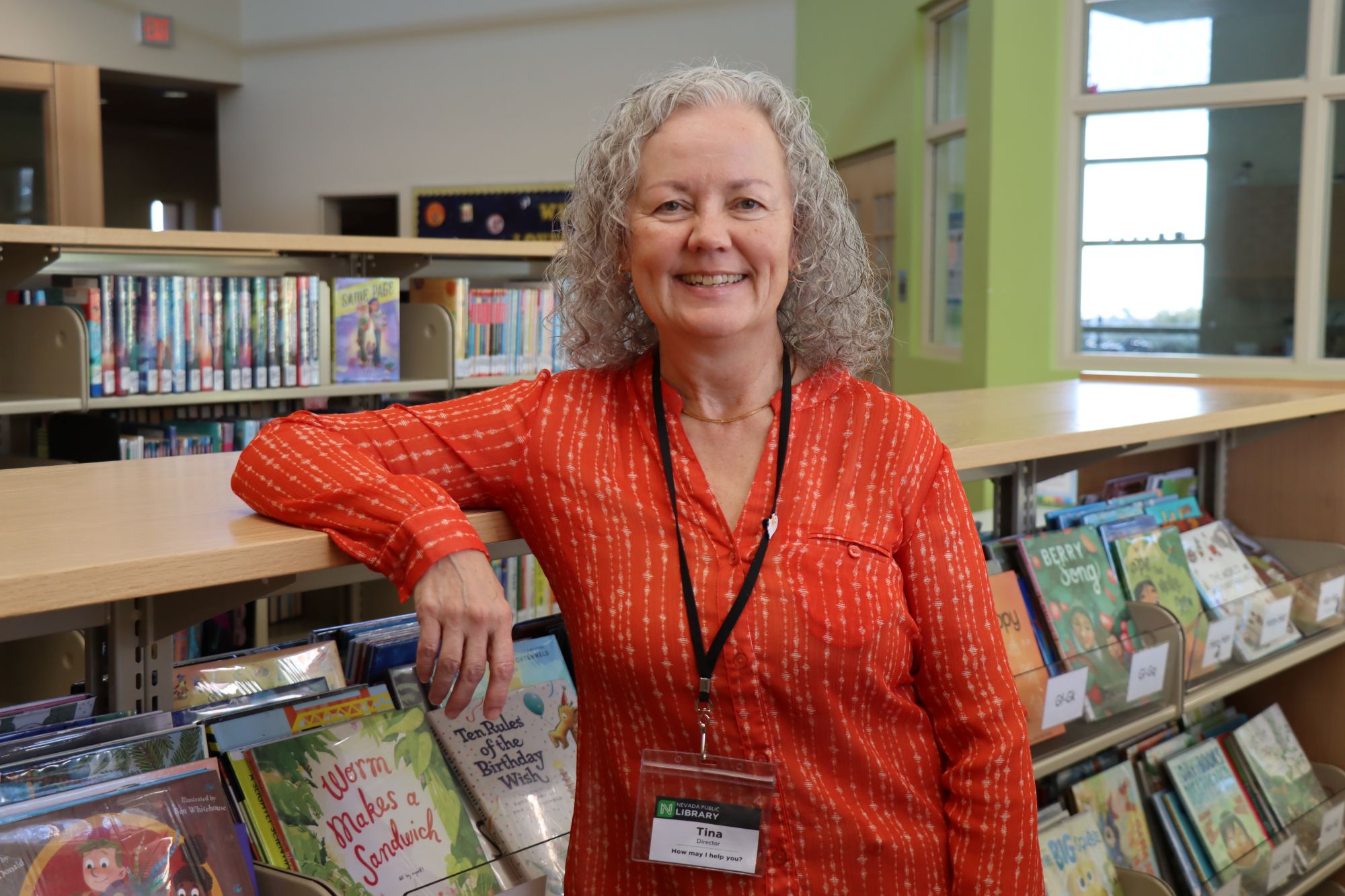 Tina Hertel is pictured in the children's book section of the Nevada Public Library.